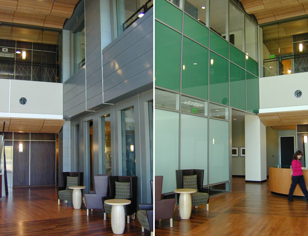 Multi-story atrium lobby with green glass curtain wall, frosted glass partitions, and modern lounge seating, Nokia Creation Center II