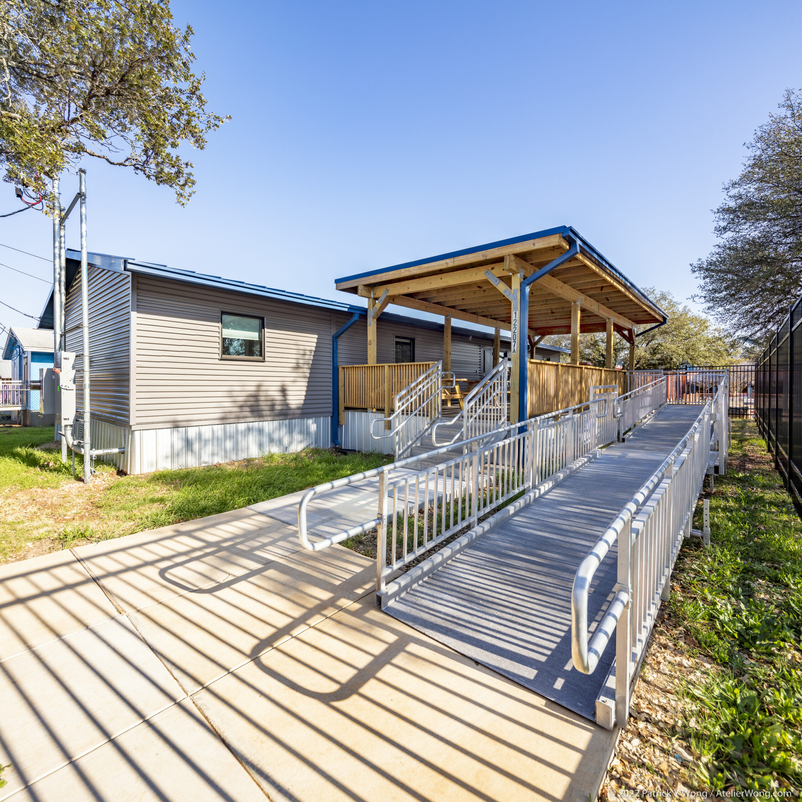 Exterior accessible ramp and covered walkway leading to a portable office building at Summitt Elementary School