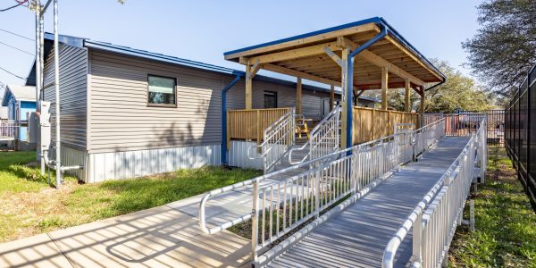 Exterior accessible ramp and covered walkway leading to a portable office building at Summitt Elementary School